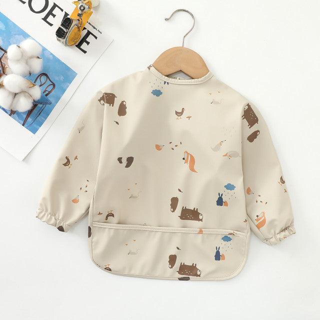 https://www.mamatoddler.com/cdn/shop/files/Long-Sleeves-Waterproof-Baby-Bibs-with-Bottom-Pocket-Mama-Toddler-Forest-Animals-3-Small-For-6-12-Months-4.jpg?v=1691689574